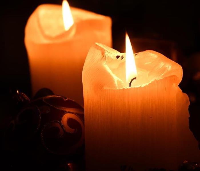 <img src =”pexels-matej-novosad-754062.jpg” alt ="candles during power outage”>